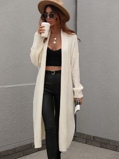 Our Drucilla Cardigan comes in a milky cream colour. Crafted from a fabric that's perfect for the breezy season, this cardi features an open front, long relaxed sleeves, a side pocket, and over knee-length hem. It easily pairs with prints and plains. Pair with jeans for a lazy day outfit or complete the look with our Jady Rose Knight Luxe Boot. Size Guide: Ambre is 5’2” tall, and has a 33.2” bust, 24.5”waist, & 36.7” hips. She is wearing a S / US 4 / AU 8. This cardigan is true to size. Feature: Solid Color Sweater, Knitting Women Cardigan, Gilet Long, Duster Cardigan, Sleeves Clothing, Knit Sleeve, White Cardigan, Loose Sweater, Knitted Cardigan