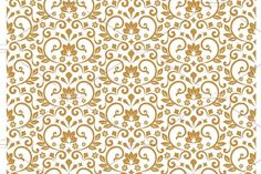 an ornate gold and white wallpaper pattern