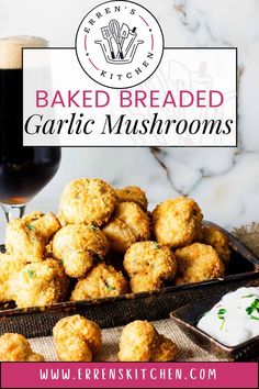 baked garlic mushrooms in front of a glass of beer