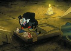 an animated character is sitting on a bed in a room with candles and other items