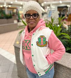 Unisex size, go down a size. -White nylon with pink stitching -Pink and green ribbing with Sherpa lining -Green buttons -Chenille Embroidered Applique Logo hooded Alpha Kappa Alpha Clothing, Aka Apparel, Sorority Paraphernalia, Aka Paraphernalia, Alpha Kappa Alpha Sorority Paraphernalia, Aka Sorority Gifts, Hooded Puffer Vest, Greek Paraphernalia, Aka Sorority