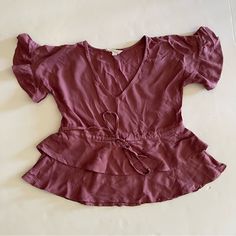 New With Tags Purple Tie-Front Ruffle Peplum V-Neck Blouse Size Xs Pit To Pit 18” Length 18” 100% Rayon Summer V-neck Peplum Top With Ruffle Hem, Feminine V-neck Top With Ruffle Hem, Chic V-neck Peplum Top With Ruffles, Elegant V-neck Peplum Top With Ruffles, Feminine Flowy V-neck Top, Spring V-neck Peplum Top With Ruffle Hem, Spring Chic V-neck Peplum Top, Fitted V-neck Tops With Ruffle Hem, V-neck Blouse For Date Night