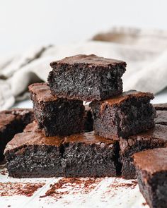 chocolate brownies stacked on top of each other