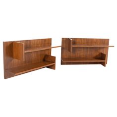 two wooden shelfs with one open and the other closed on both sides, against a white background