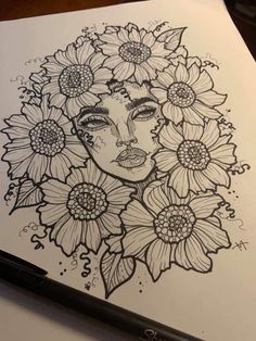 a drawing of a woman with flowers in her hair