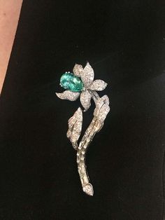 Looking for something a little more dazzling... Look no further!! This glamorous and absolutely gorgeous pear shaped natural beryl and diamond brooch is magnificent!! Beryl is a most alluring and popular mineral. It occurs in a diversity of colors, and has several important gemstone varieties. The green variety, Emerald, is one of most popular and well known as Aquamarine. The Beryl, weights 5.28 carat (14.75 x 9.92 x7.24) and is set in Platinum. The leaves are adorned with approximately 2.50 ca Elegant Green Diamond Brooch, Elegant Green Gemstone Brooch, Elegant Green Gemstone Brooches, Diamond Flower Brooch, Rare Diamond, Diamond Brooch, Diamond Bar, Heart Shaped Diamond, Baguette Cut Diamond