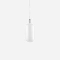 a white light hanging from a ceiling with a cord attached to the top of it