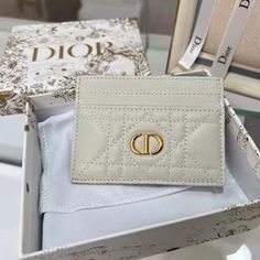 Features: Latte Supple Cannage Calfskin Reference: S5130UWHC_M030 The Dior Caro card holder presents an elegant and practical style. Crafted in latte supple calfskin with Cannage stitching, it is embellished with the CD signature on the front. Featuring five card slots, the refined accessory will fit anywhere and can be paired with other Dior Caro creations. CD signature on the front 5 card slots Dimensions: 10.5 x 7.5 x 1 cm / 4 x 3 x 0.5 inches New Handbags, Dior Bag, Evening Bags, Mini Bag, Contact Us, Calf Skin, Fashion Bags, Clutch Bag, Cd