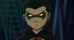 an animated image of a young man with green eyes wearing a black and red cape