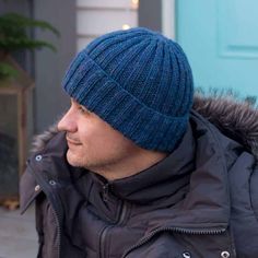 a man wearing a blue hat and jacket