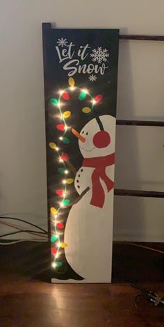 a lighted sign with a snowman on it