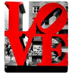 the word love is made up of red letters in front of a building and people