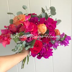 a person holding a bouquet of flowers in front of a white wall with the words bridal flowers hawaii written on it