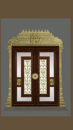 an ornate wooden door with glass panels and gold trimmings on the top half