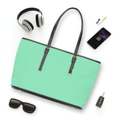 Large Leather Tote Shoulder Bag, Seafoam Green. This versatile tote bag is tailored for the modern woman who prioritizes practicality and style. This bag was created with a large interior and well-thought-out compartments, this tote effortlessly caters to your needs for any occasion. Designed with functionality in mind, it seamlessly blends into your busy lifestyle while making a fashion-forward statement. This tote allows you to showcase your individuality effortlessly. Lightweight yet sturdy, Green Rectangular Laptop Bag For On-the-go, Modern Laptop Shoulder Bag For Shopping, Functional Office Tote Bag, Functional Tote Shoulder Bag For Office, Functional Office Tote Shoulder Bag, Modern Green Bags For Daily Use, Green Tote Shoulder Bag For Office, Trendy Rectangular Laptop Bag For Shopping, Functional Green Shopping Bag