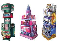 three different types of toy vending machines in various colors and sizes, each with an arcade machine