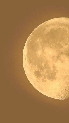 an airplane flying in front of the moon