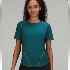 High-Neck Run And Train Reflective Tee Special Edition Size 4 Color Green Jasper New With Tags Green Crew Neck Workout Top, Green Crew Neck Top For Workout, Green Relaxed Fit Sports Top, Green Relaxed Fit Go-dry Top, Green Sporty Top With Go-dry Technology, Green Sports Top, Sporty Green Go-dry Top, Green Short Sleeve Yoga Top, Green Go-dry Tops For Running