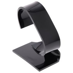 a black metal object with a curved design on it's side and an upside down section