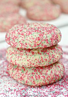 sprinkle covered cookies stacked on top of each other