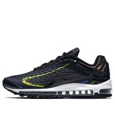 the nike air max 98 is in black and volt with neon yellow accents on the upper