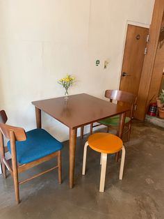 two chairs and a table in a room