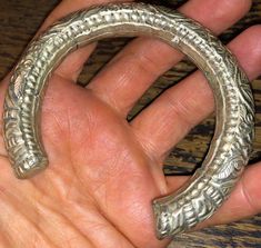 Superb late 19th century Chinese wedding bracelet, silver metal over unknown core, circa 1890s, w dragons, chrysanthemums, and the good luck Chinese symbol, shou coin. Nice weight and authentic period piece. The bracelet has an opening making it fit medium to large wrists. Fine detail, nice warm patina, unpolished, lovely. Sold as found. View all photos and zoom in for details. It's assumed you've read the description and viewed all photos before purchase. Antique Hand Cast Jewelry For Wedding, Antique Hand Cast Wedding Jewelry, Silver Carved Bracelet For Ceremonial, Antique Silver Hand-cast Bracelets, Antique Silver Hand Cast Bracelets, Unique Antique Silver Bracelet For Wedding, Antique Carved Bangle For Ceremonial Events, Antique Carved Bangle For Ceremonial Occasions, Antique Carved Ceremonial Bangle