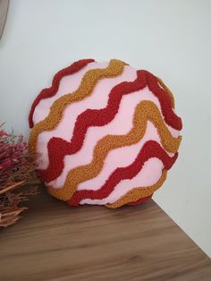 a round cake sitting on top of a wooden table