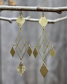 These retro, brass earrings measure 27mm in width and dangle 75mm in length from gold filled, ear wires. Bronze Nickel-free Chandelier Earrings In Brass, Handmade Brass Chandelier Drop Earrings, Bronze Nickel-free Brass Chandelier Earrings, Handmade Brass Dangle Chandelier Earrings, Brass Long Drop Chandelier Earrings As Gift, Handmade Brass Chandelier Dangle Earrings, Bronze Dangle Brass Earrings, Brass Long Drop Earrings, Nickel Free Brass Chandelier Earrings With Long Drop