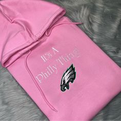 Adult Unisex It’s A Philly Thing! Eagles Embroidered Chest Pullover Sweatshirt Hoodie The Color Is Pink Green 52% Cotton And 48% Fleece Hoodie. Pink Custom Embroidery Sweatshirt For Streetwear, Pink Hoodie With Letter Embroidery For Streetwear, Pink Hoodie With Embroidered Text For Winter, Pink Letter Embroidery Hoodie For Streetwear, Winter Pink Hoodie With Embroidered Text, Pink Cotton Hoodie With Letter Embroidery, Casual Pink Hoodie With Letter Embroidery, Pink Hooded Hoodie With Custom Embroidery, Vans Hoodie