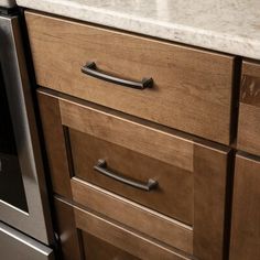 an image of a kitchen setting with marble counter tops and stainless steel appliance