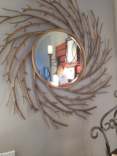 a mirror hanging on the side of a wall