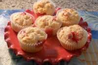 a bunch of muffins sitting on top of a red plate