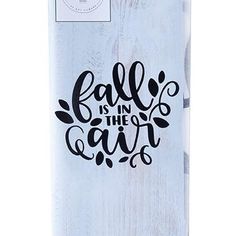 a skateboard with the words fall is in the air on it's side