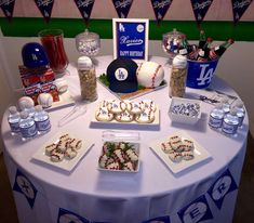 a table topped with desserts and water bottles