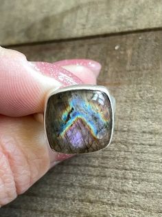 "Spectrolite Labradorite Sterling Silver Ring US Size 7.5 Labradorite stone is 15x15mm Top of ring is 5/8\" by 5/8\" 5.3g Sterling Silver, stamped 925 This Spectrolite Labradorite stone has flashes mostly purple flash with blue, yellow and orange. *Please check out my Etsy store for more one of a kind, handmade pieces that feature genuine gemstones and Sterling Silver. I love to work with unique rare gems mined in the US to support American Miners. I personally hand pick each and every single st Iridescent Labradorite Jewelry With Gemstone, Large Round Labradorite Gemstones, Gem Mining, Natural Stone Jewelry, Rare Gems, Single Stone, Labradorite Stone, Jewelry Business, Stone Jewelry