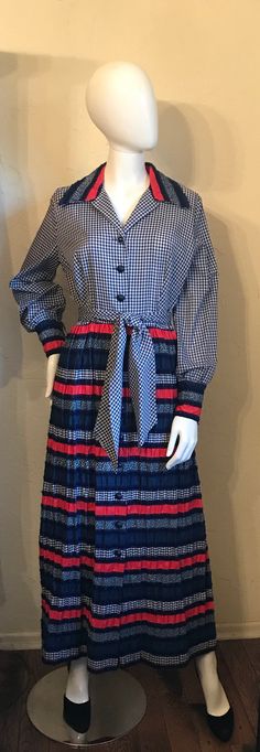 "Here is a sweetheart of a dress. It is vintage 1960's 70's in a Boho - Hippie - Country style. It is a shirtwaist style with the gingham bodice that has the contrasting print collar and has a gathered skirt in a mixed print puckered cotton blend fabrics. It also has a tie belt. Condition - good Tagged - only size / style tag remains dress. Measurements Lying Flat: Shoulder to shoulder 15\", Bust 20\", Waist 15\", Hips 24\", Length 54\", Shoulder to waist 17\"" Retro Vintage Midi Dress With Ruffles, Retro Midi Vintage Dress For Fall, Retro Patchwork Dress For Fall, Retro Vintage Dress With Ruffles For Fall, Retro Vintage Dress For Fall, 1970s Lined Vintage Dress, Retro Vintage Dress For Fall Daywear, Vintage Patchwork Daywear Dresses, Vintage Patchwork Dresses For Daywear