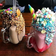 two ice cream sundaes with sprinkles and candy