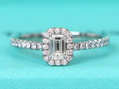 Descriptions Tiffany & Co Soleste Platinum Emerald Cut Diamond Engagement Ring  Emerald cut diamond weighs 0.35ct Diamond inscription ''T&Co.X08050507'' (see 3rd pic) Diamond H color VVS1 clarity  40 round diamonds, total weight 0.25ct Total carat weight 0.60ct Ring size 6 (this ring is resizable)  Ring stamped ''Tiffany&Co. Pt950  73023092 D0.35ct'' Ring is in excellent condition Retail price in 2023 was $5,750 Current retail price $6,000 + TAX Comes with a Tiffany ring box,Tiffany certificate, and a copy of Retail replacement valuation  Stock # 21343 Payments Payments must be received within 36 hours of auction end. Seller reserves the right to cancel transaction if payment is not received accordingly. Shipping Please note that unless seller makes a mistake or item arrived damaged, other Tiffany And Co Victoria Ring, Tiffany Ring, Emerald Diamond Engagement Ring, Engagement Ring Emerald Cut, Tiffany Engagement Ring, Emerald Ring Engagement Diamond, Tiffany Rings, Emerald Cut Diamond Engagement Ring, Ring Emerald