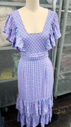 Get ready to make a statement in the Take a Guess Blue/Pink Gingham Maxi Dress! With its playful pink and blue gingham pattern, ruffle details, and flirty square neckline, this dress is the perfect choice for a gender reveal party. Plus, the tie-back waist adds a touch of fun and versatility. Let the guessing games begin! True to size. If in between sizes, size up. I’m in the medium. Sizes: Small-Large Follow tag instructions for washing. Guessing Games, Gingham Pattern, Queen Dress, Reveal Party, Pink Gingham, Blue Gingham, Dress Gift, Reveal Parties, Square Necklines