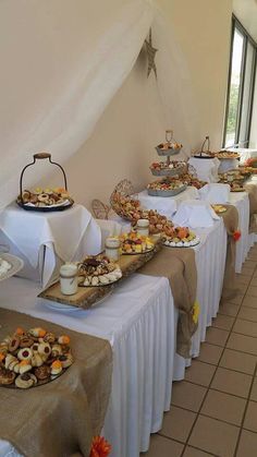 a banquet table with many desserts on it