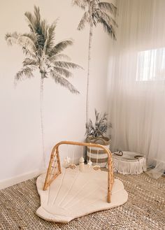 a bedroom with palm trees painted on the wall