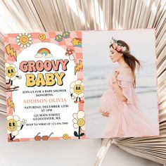 a baby announcement card with a photo of a pregnant woman in pink dress and flower headband