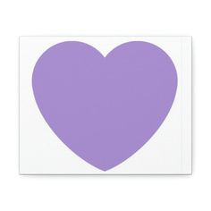 a purple heart sticker on a white square paper with the shape of a heart