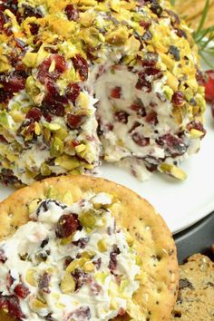 an image of a dessert with fruit and whipped cream on the top next to crackers