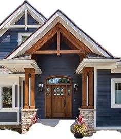 a blue house with white trim and wood accents on the front door is shown in this image