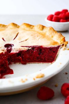 a slice of raspberry pie on a plate