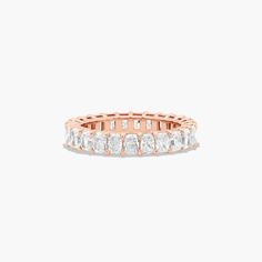 14K Rose Gold Radiant Cut Diamond Eternity Ring (3 CTW H-I / SI1-SI2). This timeless eternity ring features the boldness and intense sparkle of radiant cut diamonds. A classic, tailored shared prongs setting allows the maximum amount of the diamonds surface to show. Number of diamonds and carat total weight will vary depending on ring size. Luxury Heirloom Diamond Cut Eternity Band, Luxury Heirloom Diamond Bands, Luxury Heirloom Eternity Band With Diamond Cut, Luxury Yellow Gold Eternity Band For Wedding, Luxury Heirloom Eternity Band For Engagement, Luxury Yellow Gold Half Eternity Wedding And Engagement, Luxury Yellow Gold Eternity Band For Formal Occasions, Luxury Stackable Yellow Gold Eternity Band, Luxury Gold Eternity Band For Formal Occasions