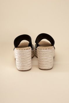 Step into style and comfort with our black Platform Espadrille Heel Mules! Perfect for any vacation or beach getaway, these mules will elevate your look with their trendy block heel. Slip them on and step out in style! Fit true to size Black High Heel Wedge Sandals For Beach, Black Wedge Heel Sandals For Beach Season, Summer Beach High Heel Mules, Beach Mules With Cushioned Footbed And Wedge Heel, Vacation Mules With Cushioned Footbed And Wedge Heel, Beach Wedge Heel Mules With Cushioned Footbed, Black Wedge Sandals With Block Heel For Summer, Cushioned Wedge Heel Mules For Vacation, Cushioned Wedge Heel Mules For The Beach