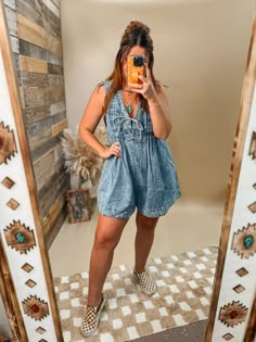 Pleated denim romper with tie front closure and POCKETS! Soft pleated denim Romper Pockets on both sides Tie front closure Oversized for Olivia is 5’2”, usually a medium top and bottoms, 34C, 29” waist wearing a size medium Denim Romper Outfit, Boutique Photoshoot, Lace Undershirt, Trendy Mom Outfits, Country Concert Outfits, Nashville Outfit, Girl Western, Simple Closet, Pleated Denim